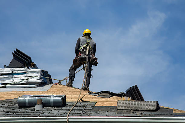 Professional Roof Replacement technician working in Dike, IA